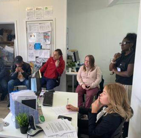 Residents and staff meeting together at Albany